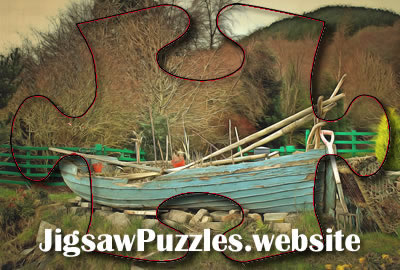 Old wooden fishing boat in a garden Jigsaw